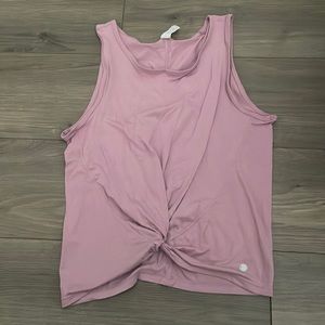 Athletic tank top with a cute upholstered tie in the front bottom of the shirt.